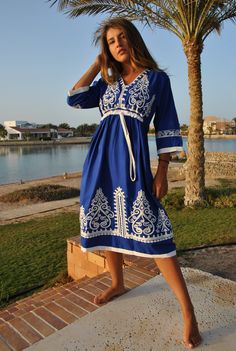 This beautiful bohemian embroidered tunic dress is surely going to add life and oriental charm to your closet. The dress is made of Egyptian cotton which is widely renowned for its quality and texture. The dress is light and extremely soft and can be used on many occasions - beach, lounge, or even in your home to feel comfortable. Fabric : 70% Egyptian Cotton; 30% Polyester. Tunic measurements in inches : Small (Size 4/6 USA) Bust : 36-37 Hip : 40-41 Medium (Size 8/10 USA) Bust : 39-40 Hip : 45- Cotton Tunic Dress For Eid, Spring V-neck Kaftan With Chikankari Embroidery, Traditional V-neck Boho Dress For Spring, Bohemian V-neck Kurta With Intricate Embroidery, Cotton V-neck Dress With Resham Embroidery, Traditional V-neck Dress With Embroidered Border, Summer V-neck Tunic With Chikankari Embroidery, Folk Style Chikankari Embroidery Dress For Eid, Folk Style Tunic Embroidered Dress