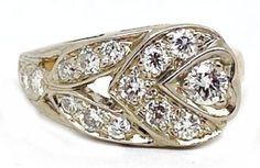 Vintage bridal, Retro style, two-tone ring. Finely handcrafted with a low profile and approximately .60 ct. total weight, average clarity is SI, with modern round cut diamonds. The ring is stamped "14K".  Weight is approximately 3.6 grams and the ring size is approximately size 3 ¾.  The condition is very good, it has been polished and is pre-owned. Be sure to check out our shop for matching pieces! Free registered insured shipping on all items in our store! White Diamond Art Deco Cluster Ring, White Marquise Cut Diamond Ring With Single Cut Diamonds, Dazzling Formal Diamond Ring With Diamond Accents, Dazzling Diamond Ring With Diamond Accents For Formal Occasions, Dazzling Diamond Ring With Accents For Formal Events, Diamond White Diamond Ring With Single Cut Diamonds, Moissanite Cluster Ring With Single Cut Diamonds For Anniversary, Art Deco Diamond Ring In Diamond White, Art Deco Diamond White Ring With Diamond Accents