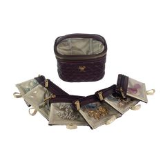 The rich and decadent Chocolate Getaway Jewelry Case is the perfect accessory for any jewelry lover! With 6 removable clear front pouches, storing earrings, rings, bracelets and more has never been more convenient. It is the perfect travel case for keeping small to medium jewelry from getting lost or tangled at home or on-the-go. Features: 6 Removable Clear Front Pouches Easy to Clean wipeable Interior Clear View Top 1 Padded Ring Strap Size Information: 5.5" L x 4" W x 3.5” H Material: Brown - Elegant Round Case Bag As Gift, Elegant Travel Cosmetic Bag With Case, Elegant Rectangular Travel Cosmetic Storage, Elegant Cosmetic And Toiletry Storage For Everyday Use, Elegant Rectangular Cosmetic Bag For Storage, Elegant Rectangular Cosmetic Storage Bag, Elegant Brown Jewelry For Everyday Use, Elegant Portable Cosmetic And Toiletry Storage For Travel, Elegant Rectangular Cosmetic And Toiletry Storage For Travel