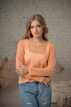 Organic linen sweater in peach for woman. Our linen sheer sweaters are designed with raglan seams to add a touch of sophistication. Knit summer sweater is the best choice, because linen yarn not only provides exceptional softness but also ensures superior moisture-wicking properties, keeping you cool and dry all day long. You have to try it on and you will feel it! Available in juicy pink fuchsia, sandy latte, soft peach, red violet, light grey and light bluish grey. - raglan sleeves - knitted f Pull Orange, Orange Jumper, Orange Jumpers, Orange Pullover, Knit Summer, Orange Texture, Sheer Sweater, Turtleneck Sweatshirt, Linen Yarn