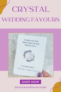 a hand holding up a wedding card with the words crystal wedding favors on it and an image