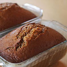 two loafs of banana bread sitting on top of a table