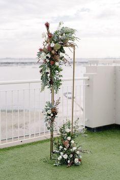 tall gold stand with multiple flower clusters in an asymmetrical design Australian Native Wedding Arch, Grit Photography, Wedding Arbours, Ceremony Arbour, Native Bouquet, Navy Blue Suits, Floral Sculptures, Rustic Wedding Flowers Bouquet