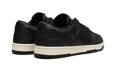 The Nike Dunk Low “Black Canvas” is a monochromatic black colorway of the popular shoe with an all-canvas construction.  The “Black Canvas” Dunk Low features a black canvas upper with tonal canvas overlays on the toe cap, forefoot, eyelets, collar, and heel.  A black leather Swoosh is found on either side of the shoe.  Black “Nike” branding is embroidered on the heel and printed on the tongue tag.  A Sail rubber midsole and black rubber outsole finish off the look.  Release date: May 2, 2023 Nike Noir, Popular Shoe, Black Canvas Shoes, Dunk Low Nike, Nike Branding, Popular Shoes, Nike Brand, Shoe Black, Sb Dunk