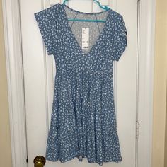 Urban Outfitters, Size Xs, Never Worn, Tags Still On Light Blue Ditsy Floral Summer Dress, Light Blue Ditsy Floral Print Short Sleeve Dress, Blue Ditsy Floral Print Beach Dress, Casual V-neck Fitted Sundress, Light Blue Casual Short Sleeve Dress, Blue Ditsy Floral Print Knee-length Dress, Blue Casual Mini Dress With Short Sleeves, Casual Blue Mini Dress For Summer, Casual Blue Short Sleeve Sundress