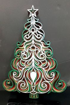 a christmas tree made out of colored paper