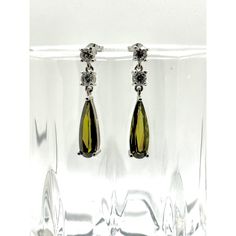 FAST SHIPPING - Most orders ship in the same day. This Eden Earrings in Peridot Stones are everything!  The silver in the earring has a layer of Rhodium and the Peridot is accompanied with crystal zirconia. The vibrance of the Peridot Stone are fabulous in these statement earrings. These long earrings are a great addition to an evening look or any other glam attire.  Gemstone Peridot has also many metaphysical properties, one of the greatest stones for neutralizing toxins in the  body. The Healing properties of peridot include lowering tension, anger and opening your heart to feelings of joy and contentment. Hypoallergenic  Nickel Free Tarnish Resistant Silver Long Drop Jewelry With Prong Setting, Green Linear Drop Earrings For Formal Occasions, Green Long Drop Earrings For Formal Occasions, Formal Green Nickel-free Earrings, Silver Long Drop Earrings With Prong Setting, Elegant Green Linear Earrings As Gift, Green Sterling Silver Crystal Earrings, Silver Linear Earrings With Prong Setting, Silver Sterling Silver Linear Earrings With Prong Setting