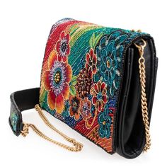 Embrace a wonderland of fun and style with this crossbody handbag. Featuring a playful rainbow of beaded & embroidered flowers on a soft leather body, this bag will add a pop of happiness to your wardrobe. Don't forget the matching Wonderland Wallet.Product Deatails 8.25" x 1.75" x 5.5" Strap Length End to End: 49" Strap Drop: 23.5" Removable crossbody chain strap with beaded leather shoulder piece, magnet closure, inside pocket, back pocket, fits a phone, leather This is a handmade item, each o Shoulder Piece, Leather Fits, Big Handbags, Accessories Inspiration, Mary Frances, Best Handbags, Handmade Purses, Top Handle Handbags, Crossbody Clutch