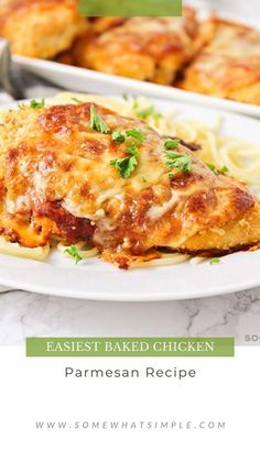 the best baked chicken parmesan recipe on a white plate with pasta and sauce