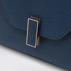 Micro shoulder bag by Valextra in sapphire blue calfskin nude-coloured, featuring a top handle, a removable and adjustable shoulder strap, a gold-tone metal clasp, a single compartment and an internal flat pocket. Composition: 100% Calf leather Timeless Blue Shoulder Bag For Evening, Luxury Blue Flap Bag With Detachable Handle, Blue Rectangular Flap Bag For Formal Occasions, Formal Blue Flap Bag With Detachable Strap, Formal Blue Rectangular Flap Bag, Blue Top Handle Flap Bag For Evening, Modern Blue Top Handle Flap Bag, Evening Blue Flap Bag With Detachable Strap, Blue Top Handle Flap Bag For Formal Occasions