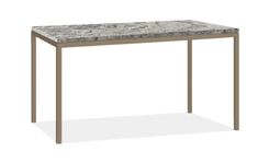 a marble top dining table with metal legs