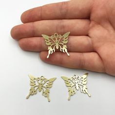 6 pcs Raw Brass Butterfly Necklace Charm, Butterfly Pendant, Laser Cut Butterfly Jewelry Findings RW-1032 Material; Brass Size: 27x23mm Hole Size: 2.00mm Plating: Raw Quantity: Optional All of our products are manufactured by us. If you want to order more products in stock, you can freely contact us. Our Products; -Nickel-free -Lead-free -High quality If you have any questions, feel free to contact us. You can read the explanations and policies for return and exchange conditions and contact us. Laser Cut Metal Jewelry Gift, Butterfly Jewelry Necklace, Brass Butterfly, Laser Cut Jewelry, Earring Charms, Gold Models, Butterfly Jewelry, Necklace Charm, Silver Jewelry Handmade