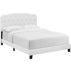 a bed with white linens and black legs is shown in front of a white background