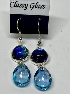 This is a pair of dichroic earrings with a dangle of teal crystal that is soooo sparkly it adds a huge addition. Iridescent Drop Earrings With Matching Jewelry, Iridescent Drop Earrings With Matching Jewelry Set, Iridescent Drop Earrings Jewelry Set, Iridescent Jewelry With Matching Drop Earrings, Glass Drop Earrings With Matching Set, Iridescent Drop Earrings For Jewelry Making, Iridescent Sparkling Earrings, Iridescent Czech Glass Dangle Earrings, Nickel-free Iridescent Crystal Earrings For Party