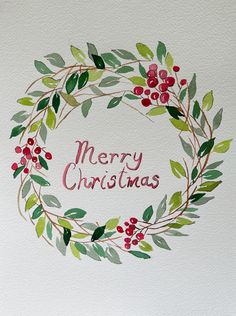 a watercolor painting of a christmas wreath with the words merry christmas on it