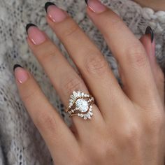 a woman's hand with a ring on it