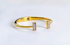 "Vintage hinged cuff bracelet from Kate Spade with an open top and two CZ lined rectangles to finish the piece.  It has a center diameter of 2¼\" across with a top opening of ¾\" and would be appropriate for a smaller wrist.  The Kate Spade - New York appears on the inside of piece. Elegant Kate Spade cuff bracelet in pristine vintage condition with free First Class Domestic shipping.  US sellers are not authorized to collect VAT/customs fees for other countries. Attention International Buyers! Photographing Jewelry, Sparkle Earrings, Yellow Gold Setting, Modern Ring, Fun Earrings, Vintage Bracelets, Gorgeous Necklaces, Kate Spade New York, Pearl Jewelry