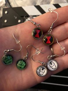 Handmade Marvel Inspired Stainless Steel Earrings—Choose Your character Nickel Free Themed Black Jewelry, Novelty Black Round Jewelry, Black Round Novelty Jewelry, Nickel-free Themed Stainless Steel Jewelry, Themed Nickel-free Stainless Steel Jewelry, Nickel-free Round Surgical Steel Jewelry, Avengers Jewelry, Marvel Earrings, Marvel Ideas