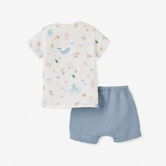 Good for baby, good for the environment. Our organic, naturally sustainable muslin is soft and breathable, ideal for outdoor adventures during the spring and summertime. Cast in a dreamy palette, this muslin tee + short set combines fashion and function for the modern child. Wooden buttons add an extra dash of style to this already stunning organic baby set.
100% organic cotton muslin, GOTS certified
Machine wash cold, tumble dry low Playful Blue Organic Cotton Tops, Cotton T-shirt For Bedtime In Summer, Playful Bedtime Tops For Summer, Summer Cotton T-shirt For Bedtime, Cotton Summer T-shirt For Bedtime, Playful Summer Bedtime Tops, Casual Summer Bedtime T-shirt, Casual Summer T-shirt For Bedtime, Light Blue Short Sleeve Top For Bedtime