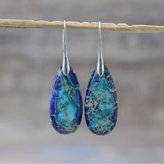 Natural Gemstone Dangle Earrings. Lovely Blue And Gold With Silver Hook. Purchased From Etsy, See Photos For Description. Never Worn. Blue Teardrop Earrings For Summer Gift, Summer Blue Teardrop Earrings As Gift, Blue Teardrop Jewelry For Summer, Blue Teardrop Summer Jewelry, Blue Drop Earrings With Natural Stones, Blue Gemstone Teardrop Dangle Earrings, Blue Bohemian Drop Earrings, Bohemian Blue Drop Earrings, Zambia