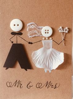 a wedding card with buttons and paper dolls on the front that says mr & mrs