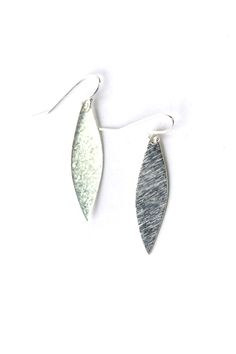 Elegant marquis shapes are created from brush silver plated brass. They are shorter in design and dangle at approximately 1.5" from sterling silver ear wires. Silver Plated Brass (Nickel & Lead Safe) 1.5", with sterling silver ear wires We hand select our natural materials, thus there may be slight variations in color and/or size that will not detract from the overall aesthetic Our unique handcrafted designer jewelry for women is made in America, each design created individually in our personal Silver Leaf-shaped Jewelry With Ear Wire, Silver Leaf-shaped Metal Earrings, Modern Silver Marquise Jewelry, Modern Marquise Silver Jewelry, Modern Silver Earrings With French Hook, Floyd Va, Silver Statement Earrings, Designer Handmade Jewellery, Sterling Silver Dangle Earrings