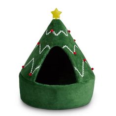 a green christmas tree shaped cat bed with a gold star on it's top