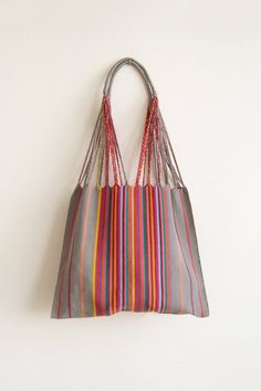 These versatile totes are handwoven by artisans in Chiapas, Mexico on a backstrap loom. Perfect for a beach day, the farmer's market, or as an everyday purse! This bag is approx. 16" wide x 26" tall with the strap. Due to the handmade nature, height and width of bag can vary up to 10%. Hammock Bag, Inkle Weaving, Handwoven Bag, Backstrap Loom, Textile Bag, Everyday Purse, Newspaper Crafts, Handwoven Fabric, Farmer's Market