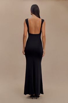 Understated glamour. The MALIA Slinky Ruched Maxi Dress is a masterclass in elegant design. Featuring a sophisticated boat neckline and daring open back, this bodycon dress flatters your silhouette with gathering detail at the bust. The fishtail hem adds a touch of drama, creating a graceful flow with every step. Fully lined for a smooth finish, Malia is the epitome of refined style. Night Out Dress With Ruched And Closed Back, Fitted Maxi Dress With Ruched Back For Gala, Fitted Maxi Dress With Cowl Back For Night Out, Fitted Bodycon Dress With Cutout Back, Elegant Stretch Maxi Dress With Ruched Back, Party Dress With Ruched And Closed Back, Elegant Dress With Cutout Cowl Back, Stretch Ruched Backless Dress For Evening, Fitted Maxi Dress With Cowl Back For Party