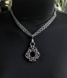 A bold statement of Norse style and power, this handmade Viking Chain Chainmail Necklace is sure to turn heads! Crafted with stainless steel, this gorgeous necklace won't tarnish and will stay looking stunning no matter your adventure. Choose your length to pair with any outfit, from choker to long necklace. Embrace your inner Viking or Gothic queen with this one-of-a-kind piece! Chainmail Byzantine, Chainmail Pendant, Warrior Jewelry, Gothic Queen, Jump Ring Jewelry, Chainmail Necklace, Goth Necklace, Viking Shield, Chainmail Jewelry