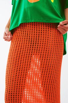 Make a statement with our Maxi Sheer Crochet Skirt in Orange. This stunning skirt is crafted from a blend of 45% viscose, 35% polyamide, and 20% acrylic, offering a comfortable and breathable fit. The bodycon fit and high waist rise enhance your curves and create a flattering silhouette. The midi length adds an elegant touch, while the sheer crochet design exudes boho vibes. The elastic waist ensures a secure and comfortable fit. Our model, with measurements 31-24-35 and a height of 5'10", is we Spring Mesh Mini Skirt, Mesh Mini Skirt For Spring, Knit Mini Skirt For Summer, Summer Stretch Mesh Skirt, Summer Mesh Mini Skirt, Chic Pointelle Knit Spring Skirt, Chic Spring Pointelle Knit Skirt, Chic Pointelle Knit Skirt For Spring, Spring Pointelle Knit Skirt