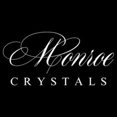 a black and white logo with the words monroe crystals in cursive font