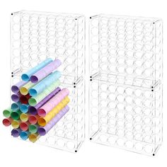 two white bins filled with lots of different colored paper tubes on top of each other