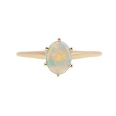 an opalite ring set in yellow gold