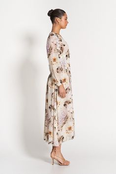 Cut in our label-exclusive Flora Print, the whimsical Capri Sheer Midi Dress is designed to elegantly shape and flatter. Comfortable and versatile, the dress is composed of a sheer georgette with features including a v-neckline, blouson sleeves, tailored torso and sculpted waistband. Model is 176cm and wears a size 8.Fits true to size. - 100% Viscose- 100% Polyester Lining- Elasticated Cuffs- Functional Self-covered Buttons- Fully Lined (ex. Sleeves) Flowy Viscose Dress For Spring, Flowy Viscose Dresses For Daywear, Feminine Chiffon Midi Dress For Daywear, Viscose Daywear Dress With Flowy Skirt, Elegant Floral Maxi Dress For Daywear, Feminine Flowy Viscose Midi Dress, Chiffon Long Sleeve Daywear Dress, Chiffon Long Sleeve Day Dresses, Flowy Long Sleeve Dress For Daywear