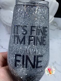 Silver glitter top ombre fade to black on bottom, high sparkle, smooth shiny finish.   I'm Fine It's Fine everything is Fine Other color combinations available, message me with your preference New stainless steel double walled insulated tumbler.   Completed cup is covered with high quality crystal clear FDA compliant epoxy resin for long lasting smooth shiny wear. Reusable travel cup. Beverages will stay warm for 8 hours and cold for 24+ hours. Choose your cup size.  Includes splash resistant lid  We design and create each embellished tumbler once ordered.   These products are hand made to order.  Feel free to purchase them for any occasion or gift. Perfect for gifts, teachers, coworkers, birthdays, bridesmaids, weddings, employee, thank you, friends, family, reunion, retreat, teams, clubs Black Silver Ombre, Black To Silver Ombre, Silver Ombre, Glitter Top, I'm Fine, She & Him, Personalized Tumbler, Everything Is Fine, Travel Cup