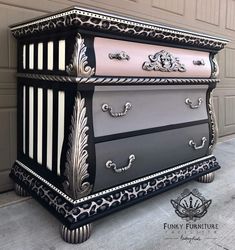 an ornate dresser painted in black, white and pink