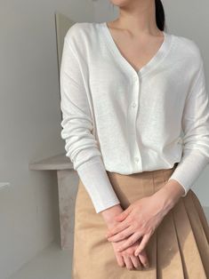 Lightweight summer v-neck cardigan. Button through front and slim fit. Soft and cozy texture. Natural silky, luxurious material. Model is in MINUSEY ONE SIZE. ✔️ Free worldwide express shipping over $100✔️ Loved by 6,500+ customers✔️ Limited edition collections, maximum style⠀⠀⠀⠀⠀⠀⠀⠀⠀Stay ahead of the trend with can’t-find-anywhere-else staples. Your closet will thank you 💕* MINUSEY ONE SIZE = EU 34-38, US 2-6* 35% Silk / 20% Wool / 45% Nylon* Dry clean* Made in Korea - Model Height: 172cm/5'7" (US2, EU34) Classic V-neck Fine Knit Cardigan, Solid Color V-neck Cardigan For Everyday, Solid V-neck Cardigan For Layering, Everyday White V-neck Cardigan, Everyday Solid V-neck Cardigan, Everyday Solid Color V-neck Cardigan, Everyday V-neck Cardigan, Versatile V-neck Cardigan With Button Closure, Elegant Solid V-neck Sweater For Spring