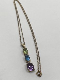 Gorgeous Gold Vermeil 925 Sterling Silver Genuine Diamond Gemstone Necklace Excellent condition Sterling silver with gold vermeil overlay. Small genuine diamonds surrounded by 3 multi-color gemstones; an amethyst, a blue topaz and a peridot. GREAT DEAL! It will look beautiful on any one who wears it! Please message me with any questions Shipped insured/delivery confirmation I guarantee item to be exactly as described and pictured. Multicolor Hallmarked Necklace For Anniversary, Oval Amethyst Multi-stone Necklaces, Amethyst Oval Multi-stone Necklace, Oval Amethyst Multi-stone Necklace, Multi-stone Amethyst Necklace For Anniversary, Amethyst Multi-stone Necklace For Anniversary, Black Opal Pendant, Carnelian Necklace, Initial Ring