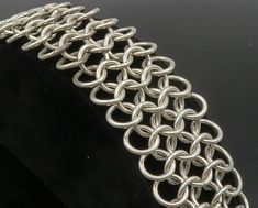 "925 Sterling Silver - Vintage Interlocking Circle Link Chain Bracelet - BT4827  925 Sterling Silver - Vintage Interlocking Circle Link Chain Bracelet - BT4827  Jewelry Type:         Bracelet   Metal Type:            925 Silver  Metal Size:             7.5\" Length  1.25\" Height   Stone Type:            N/A  Condition:              N/A  Jewelry Weight:     73.1 Grams  PLEASE NOTE: THIS ITEM IS PRE-OWNED. ALTHOUGH MOST ITEMS ARE IN VERY GOOD CONDITION, SOME MAY NEED CLEANING AND/OR MINOR REPAIRS. WE MAKE A VERY STRONG EFFORT TO UPLOAD CLEAR PICTURES. PLEASE INSPECT ALL PICTURES AND ASK ALL QUESTIONS YOU MAY HAVE PRIOR TO MAKING A PURCHASE. NOT ALL STONES ARE GENUINE, SOME ARE ENHANCED OR CREATED." Elegant Link Bracelets With Jump Ring, Elegant Chain Link Bracelets With Jump Ring, Silver Chain Bracelet With Jump Ring, Silver Link Bracelet With Jump Ring, Chainmaille Tutorial, Chain Maille Jewelry, Bracelet Metal, Link Chain Bracelet, Metal Bracelets