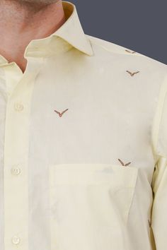 Step into sophistication with our Bone Beige Birds Printed Jacquard Textured Premium Giza Cotton Shirt. The exquisite jacquard texture adds a touch of luxury, while the birds printed design enhances its charm. With a cutaway collar, this shirt seamlessly combines style and comfort, making it a refined choice for any occasion. Fused collar and cuffs, collar stand and flat felled side seams provide structure and stability to all our shirts. 100 % Premium Giza Cotton: Long staple, smother, resistan Formal Festive Embroidered Shirt, Festive Formal Embroidered Shirt, Fitted Embroidered Shirt With Spread Collar, Traditional Embroidered Shirt For Formal Occasions, Formal Embroidered Cotton Shirt, Festive Cotton Formal Top, Formal Festive Cotton Tops, Festive Fitted Shirt For Semi-formal Occasions, Festive Fitted Semi-formal Shirt