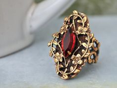 Beautiful Victorian style antiqued brass ring with sparkle ruby red Swarovski glass jewel set in center. All metal parts are brass based and are torch soldered together.    Measurement, Adjustable band that fits U.S size 6 to 10. Dark Victorian, Bijoux Art Nouveau, Neo Victorian, Pink Swarovski, Fashion Jewelry Sets, Brass Ring, Victorian Jewelry, Fantasy Jewelry, Sea Glass Jewelry