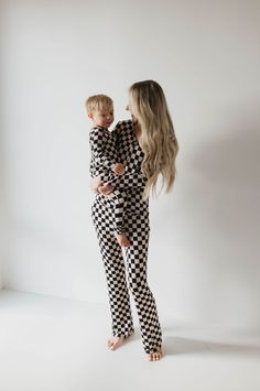 Experience dreamy sleep and effortless style with our Black Checker Bamboo Pajamas – crafted from 100% bamboo fabric for a luxuriously soft feel. Relax into the comfortable fit and timeless black checker board pattern, designed for the modern woman who values quality and comfort. Our favorite pajamas are now available for women too! These pajamas feature snaps down the front for easy accessibility for breastfeeding moms and elastic waistbands ensure max comfortability. Material : 95% bamboo viscose / 5% spandex Happy List, Diaper Bag Accessories, French Baby, Checker Board, Pajama Romper, Bamboo Pajamas, Black Checkered, Bamboo Fabric