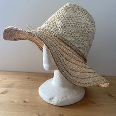 Lightweight Two-Tone Woven And Braided Straw Sunhat. This Has A Wide, Floppy Brim, And Open Weave Light Raffia Crown With Twisted Twine Finish In A Bow. The Hat Has An Adjustable Hook & Loop Strap To Fit Most Head Sizes. Brand New With Tags. Inner Diameter: 57 Cm Lightweight Cream Straw Hat For The Beach, Lightweight Cream Straw Hat For Beach, Bohemian Beige Sun Hat For Garden Party, Cream Beachy Hat For Vacation, Beachy Cream Hat For Vacation, Lightweight Cream Brimmed Straw Hat, Lightweight Cream Straw Hat With Wide Brim, Cream Lightweight Brimmed Straw Hat, Curved Brim Neutral Hat For The Beach