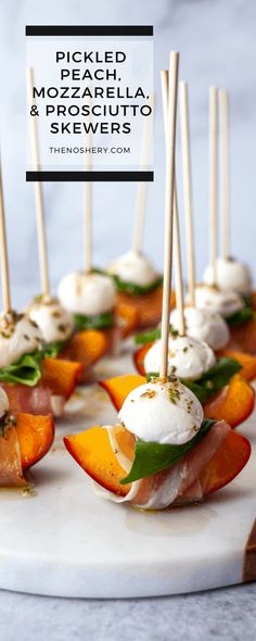 small appetizers with mozzarella and prosciutto are on a platter