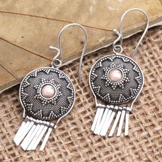 Heads will turn when you wear Sukartini's exquisite gold and silver dangle earrings. Balinese artisans center a sterling silver coin with a smooth 18k gold-plated sterling silver circle embellishing the silver with an intricate dot motif. Polished sterling silver tassels dangle elegantly from the coin while shining silver hooks finish the pair. Silver Circle, Silver Dangle Earrings, Sterling Silver Dangle Earrings, Silver Coin, Balinese, Silver Earrings Dangle, Silver Coins, Hook Earrings, Gold Plated Sterling Silver