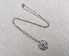 "This is a understated and elegant little boho disc pendant necklace. It is perfect for everyday wear and would go with just about anything. The disc measures 3/4\" long by 5/8\" wide and is made from allergy free plated silver. It hangs from a simple stainless steel necklace chain. I have matching earrings in my shop, if you would like the whole set. Here is the link https://etsy.me/2VZ551y Thanks for stopping by! Please take a moment and visit the rest of my Etsy shop. I have many more unique Silver Dainty Necklace For Festivals, Bohemian Silver Charm Necklace With Delicate Chain, Silver Delicate Chain Bohemian Jewelry, Bohemian Silver Jewelry With Delicate Chain, Silver Bohemian Jewelry With Delicate Chain, Bohemian Sterling Silver Charm Necklace With Adjustable Chain, Bohemian Jewelry With Delicate Chain, Bohemian Silver Necklace With Delicate Chain, Silver Bohemian Necklace With Delicate Chain