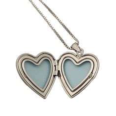 This elegant heart shaped locket is laser engraved with a classic Jewish Star of David on the front. It has beautiful engraved detailing on the border as well. The pendant has a matte/frosted finish and has space to hold two small heart shaped pictures inside. It comes on a sterling silver box chain, available in 16", 18" or 20" The perfect gift for mom or grandma! The locket measures approximately 1" long by 3/4" wide. Silver Heart Pendant Locket Necklace With Hallmark, Silver Double Heart Locket Necklace With Heart Charm, Nickel-free Open Heart Necklace For Keepsake, Nickel-free Heart Locket Necklace For Memorial, Heart-shaped Nickel-free Locket Necklace For Memorial, Double Heart Locket Necklace Keepsake, Double Heart Locket Necklace In White Gold, Double Heart Locket Necklace For Keepsake, Double Heart White Gold Locket Necklace