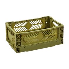 a green plastic crate with arrows on the bottom and sides, in front of a white background