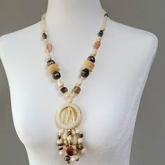 Real Stones Complement Cream Beads For A Soft And Soothing Look And Feel. Antiqued Silver Bead Accents Beaded Chain Dangle Necklace In Costume Jewelry Style, Beige Jewelry With Dangling Beads For Gift, Beige Beaded Chain Necklace With Round Beads, Beaded Dangle Necklace In Costume Jewelry, Beige Jewelry With Dangling Beads As Gift, Costume Jewelry Necklace With Beaded Chain And Dangle Shape, Beaded Chain Dangle Necklace Costume Jewelry, Beaded Dangle Pearl Necklace, Elegant Round Necklaces With Dangling Beads